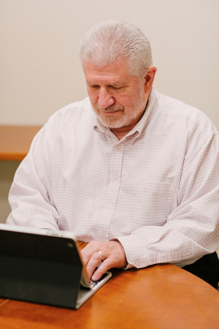 Dan Barton at a laptop, writing